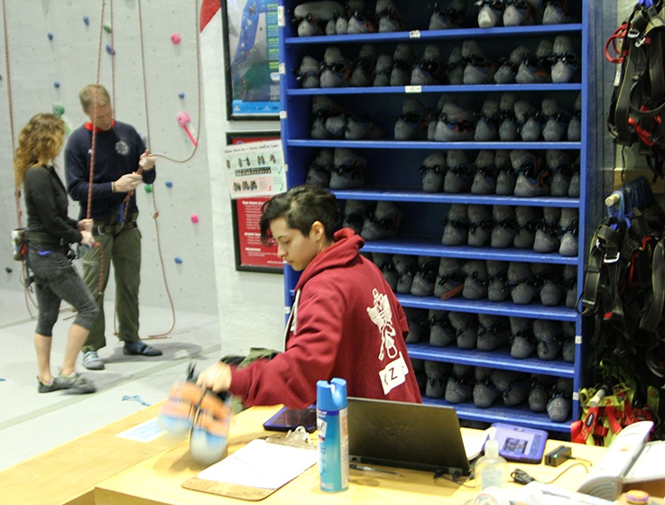 Sofia Villacreses '19 working her weekly shift as a climbing czar at the Lindseth Climbing Center.