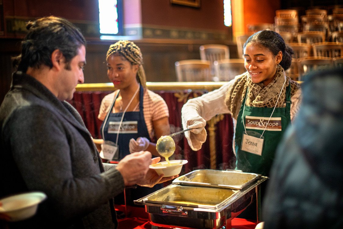 Volunteers serve soup in Sage Chapel
